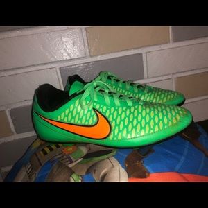 Nike soccer cleats color way green, orange